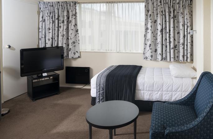 Single Bed & Television in Triple Room